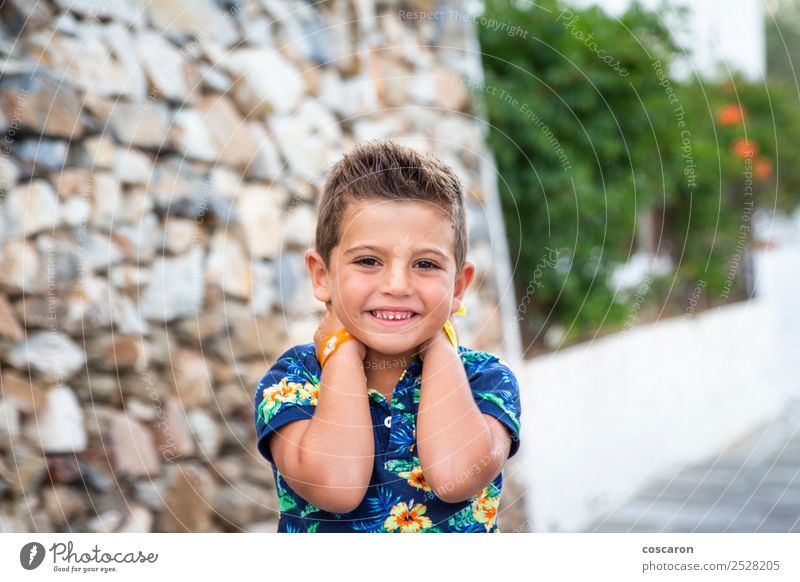 Portrait of a cute little boy against of a stone wall Style Happy Beautiful Face Summer Child Camera Human being Baby Toddler Boy (child) Man Adults Infancy 1
