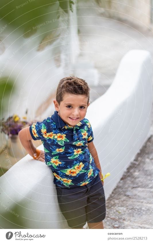 Portrait of a cute little boy against of a stone wall Style Happy Beautiful Face Summer Child Camera Human being Masculine Baby Toddler Boy (child) Man Adults