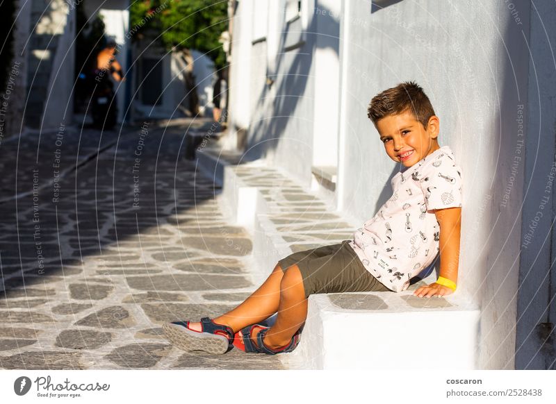 Little boy seated on a stone bench. Vacation & Travel Tourism Summer Island House (Residential Structure) Landscape Flower Village Town Building Architecture