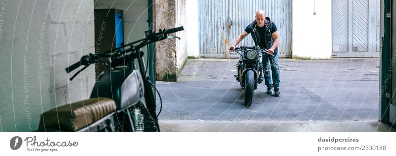 Biker taking motorbike to the garage Lifestyle Style Vacation & Travel Trip Engines Human being Man Adults Street Vehicle Motorcycle Bald or shaved head Stand