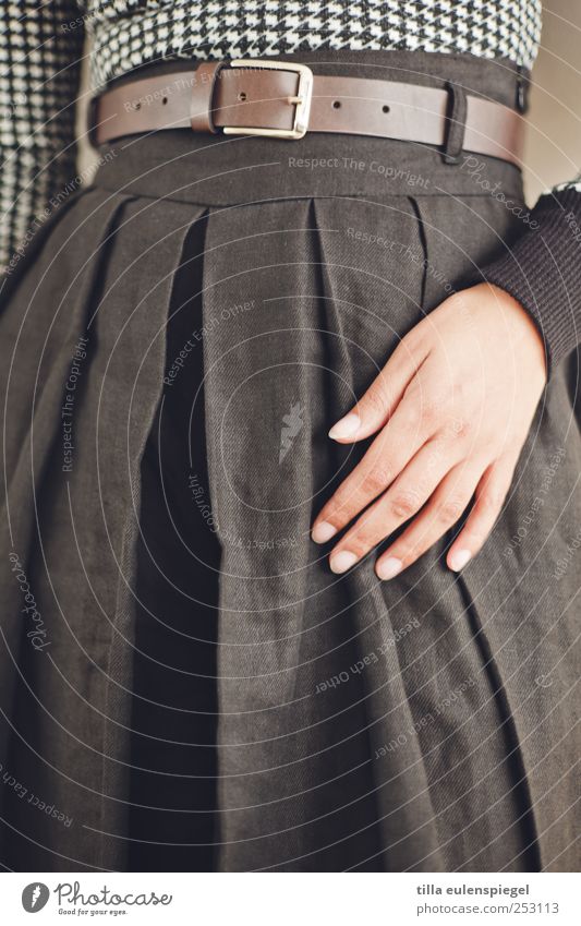 . Feminine Woman Adults Hand 1 Human being Skirt Belt Touch Fashion Belt buckle Fingernail Groomed Colour photo Interior shot