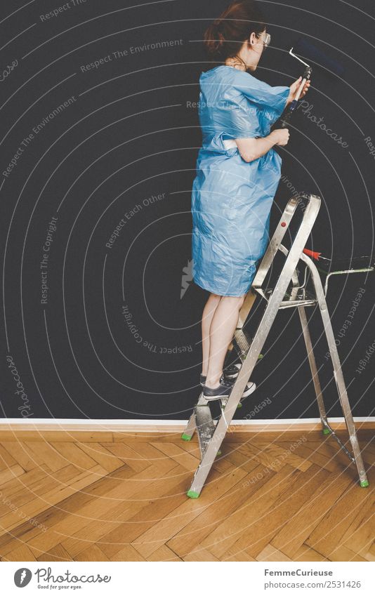 Woman in protective clothes coloring a wall with a paint roller Leisure and hobbies Feminine Adults 1 Human being 18 - 30 years Youth (Young adults)