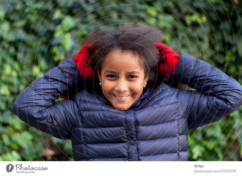 Pretty girl with long afro hair Happy Beautiful Face Winter Garden Child Human being Woman Adults Infancy Park Coat Brunette Afro Smiling Happiness Long Cute