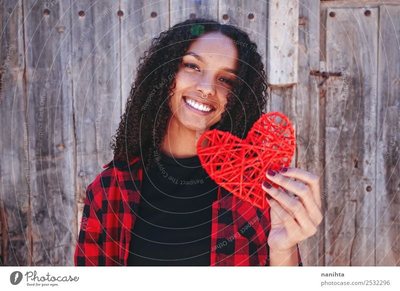 Beautiful and happy young woman holding a heart Lifestyle Style Design Joy Human being Feminine Young woman Youth (Young adults) 1 13 - 18 years 18 - 30 years