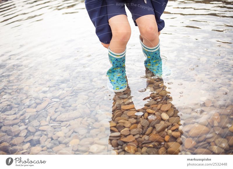 Boy with rubber boots in the water Leisure and hobbies Playing Vacation & Travel Tourism Trip Adventure Far-off places Freedom Expedition Camping Summer