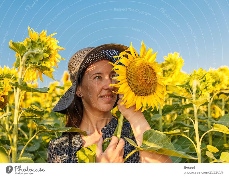 woman and sunflowers Lifestyle Happy Tourism Adventure Human being Feminine Woman Adults Female senior Head Face 1 45 - 60 years Landscape Plant Clouds Flower