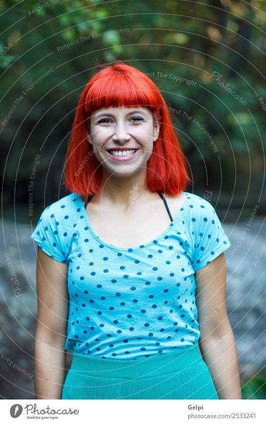 Redhead woman with blue shirt in a beautiful park Lifestyle Happy Beautiful Face Wellness Relaxation Fragrance Summer Garden Human being Woman Adults Nature