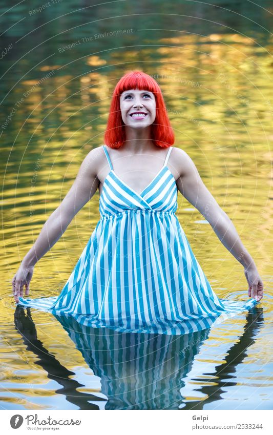 Happy girl in a lake with a blue drees looking up Lifestyle Style Beautiful Harmonious Relaxation Leisure and hobbies Freedom Summer Woman Adults Nature