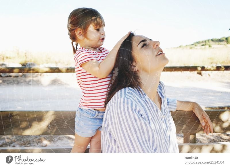 Little girl touching the head of her mom Lifestyle Style Joy Beautiful Hair and hairstyles Wellness Relaxation Human being Feminine Child Toddler Girl