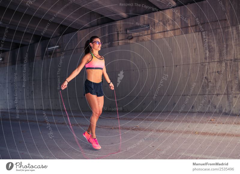 athletic woman jumping with skipping rope Lifestyle Happy Beautiful Body Wellness Sports Rope Woman Adults Movement Fitness Skipping Jump Thin Energy workout