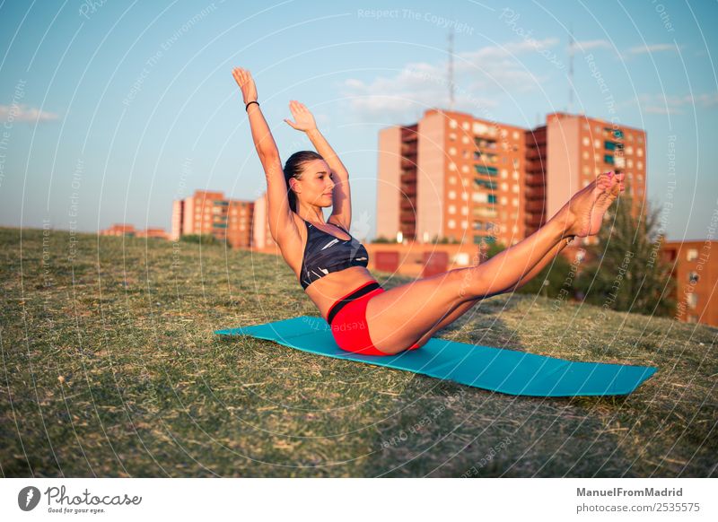 athletic woman working out on a mat in the park Lifestyle Beautiful Health care Wellness Sports Woman Adults Park Fitness Athletic Esthetic Contentment Peace