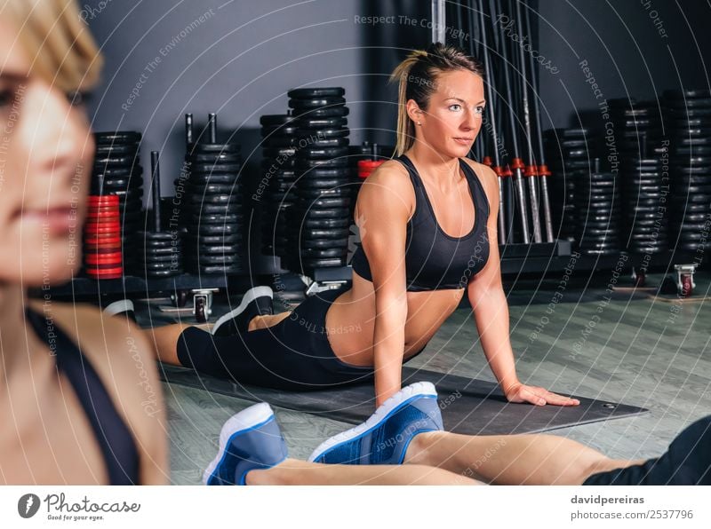 Woman stretching back in a fitness class Lifestyle Happy Beautiful Body Sports School Adults Arm Group Blonde Braids Fitness Authentic Muscular people Practice