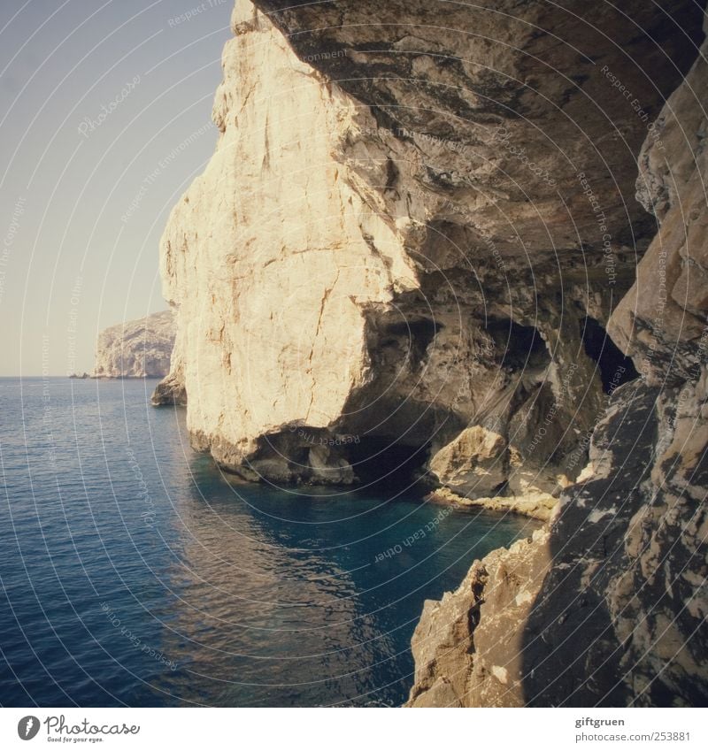 there is a crack in everything Environment Nature Landscape Elements Water Sky Cloudless sky Horizon Beautiful weather Rock Coast Ocean Island Esthetic Sardinia