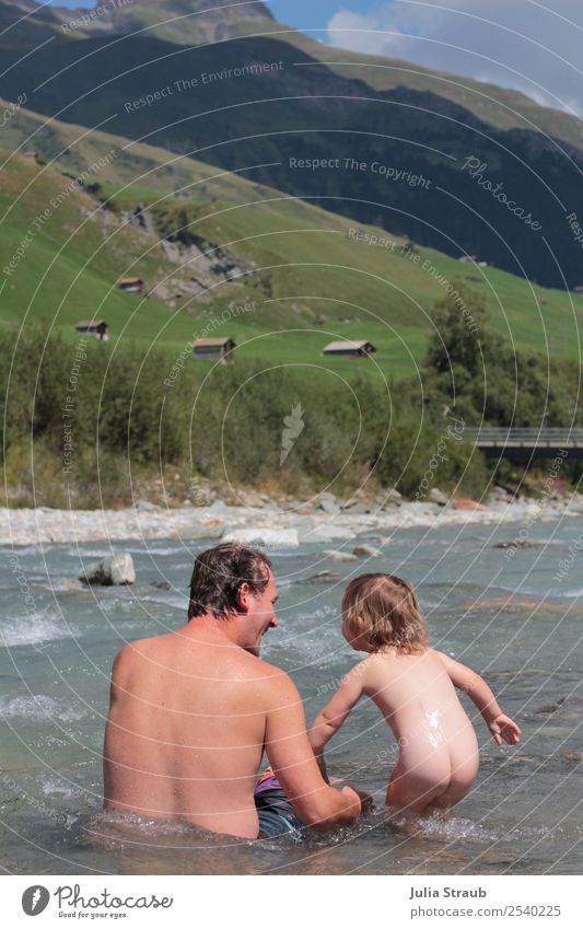 Baden river Switzerland mountains Toddler Girl Man Adults Father Family & Relations 2 Human being 1 - 3 years 30 - 45 years Sky Clouds Summer Beautiful weather