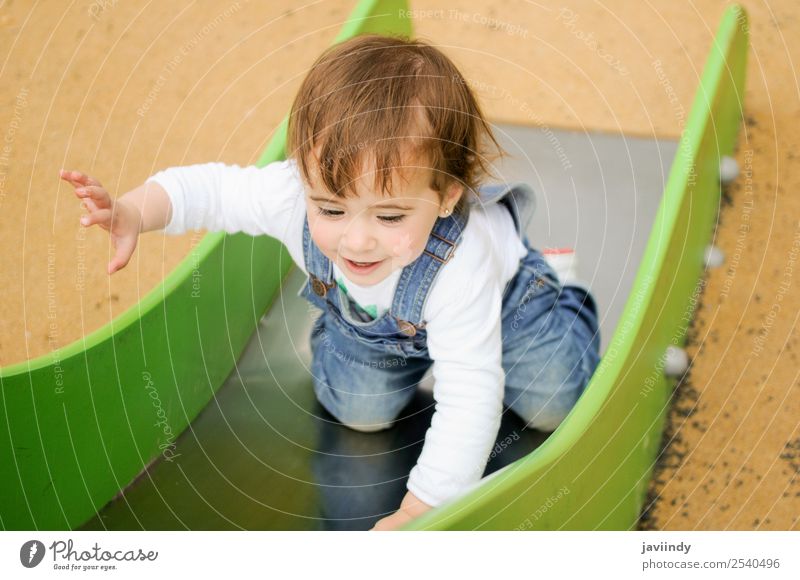 Baby girl playing in urban playground Lifestyle Joy Happy Beautiful Leisure and hobbies Playing Summer Climbing Mountaineering Child Human being Feminine