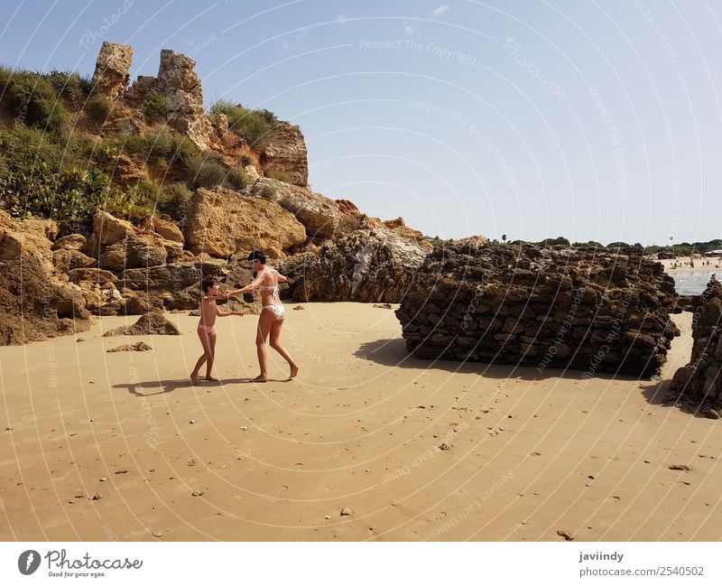 Mother and little daughter having fun on the beach of the Wall of Puerto Sherry Lifestyle Joy Happy Beautiful Playing Vacation & Travel Summer Sun Beach Ocean