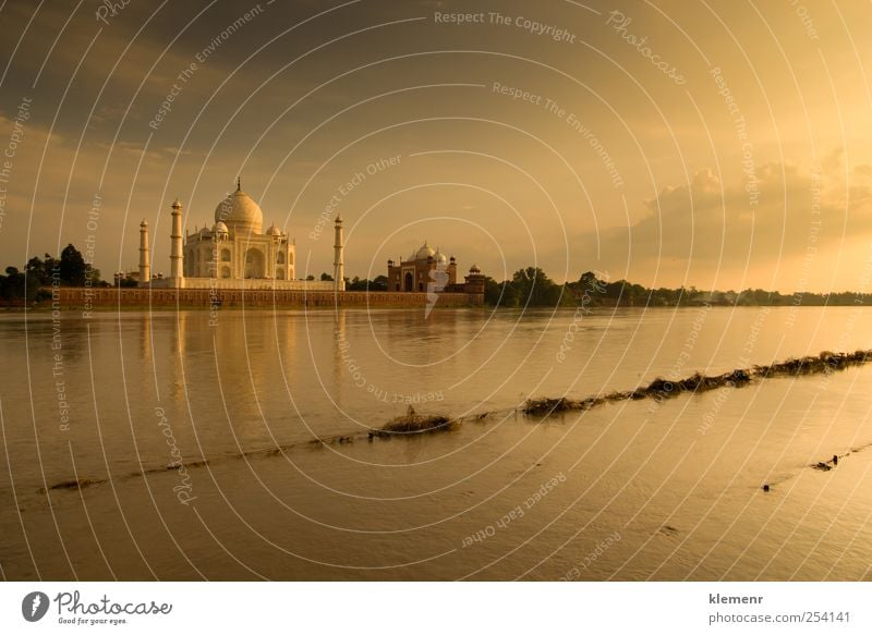Taj Mahal in sunset scene Environment Water Clouds River bank Places Architecture Mosque Palace Vacation & Travel Esthetic Authentic Exceptional Gigantic Bright