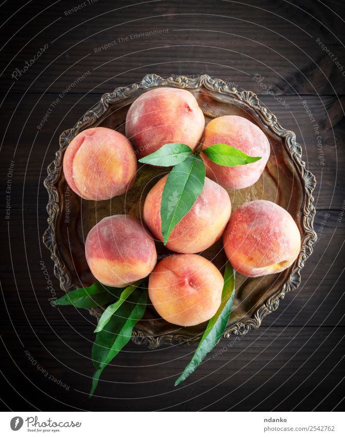 fresh ripe peaches Fruit Dessert Nutrition Vegetarian diet Bowl Gardening Leaf Wood Fresh Natural Juicy Yellow Green Red Peach Raw Mature sweet background