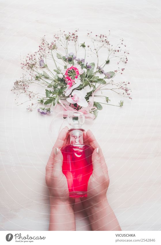 Perfume in female hands with flowers Style Design Beautiful Cosmetics Spa Feminine Woman Adults Hand Nature Flower Blossom Pink Background picture Blog