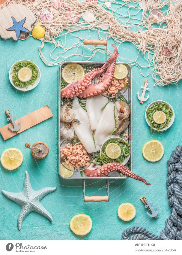 seafood on a blue kitchen table Food Seafood Nutrition Crockery Shopping Style Design Healthy Eating Restaurant Octopus Squid Cooking Food photograph Algae