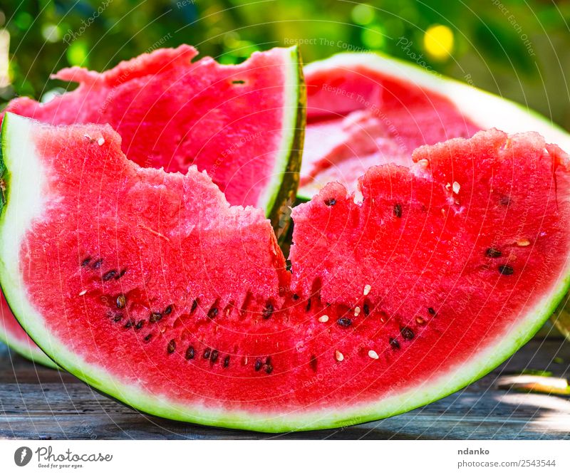 slice of ripe red watermelon Fruit Candy Nutrition Vegetarian diet Summer Table Nature Wood Fresh Delicious Natural Juicy Green Red Colour Water melon Organic