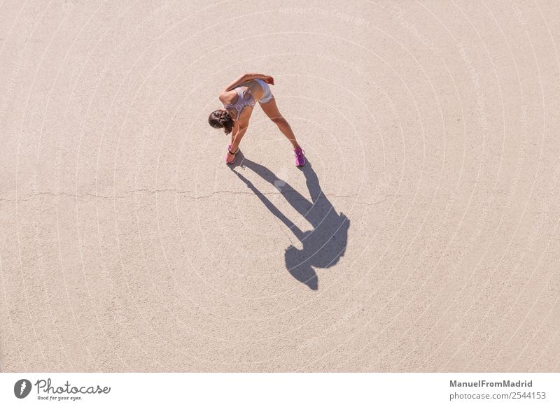 Overhead view of a woman runner stretching Lifestyle Happy Beautiful Body Wellness Summer Sports Jogging Human being Woman Adults Fitness Runner overhead