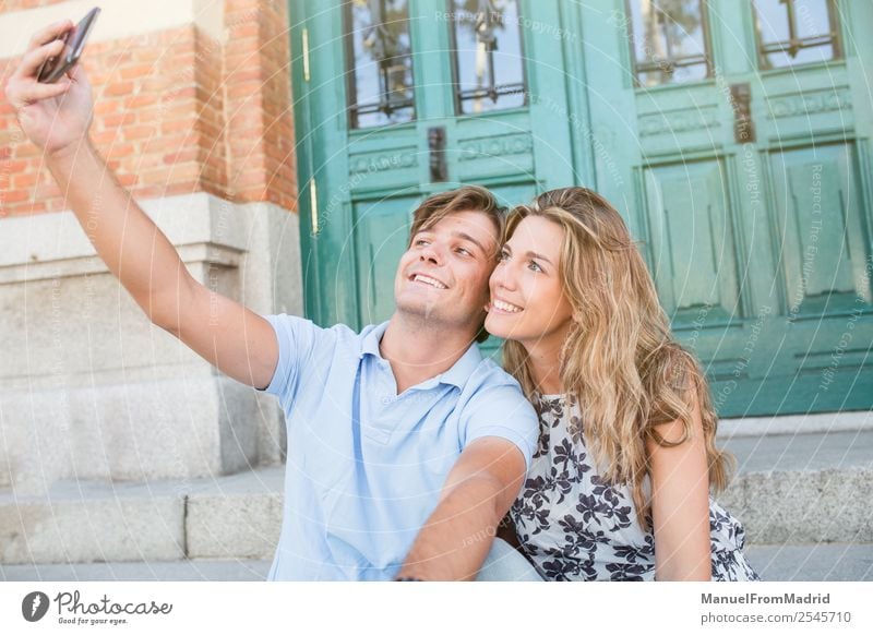 young cheerful couple taking a selfie Lifestyle Joy Happy Beautiful Leisure and hobbies Vacation & Travel Summer Telephone Camera Woman Adults Man Couple