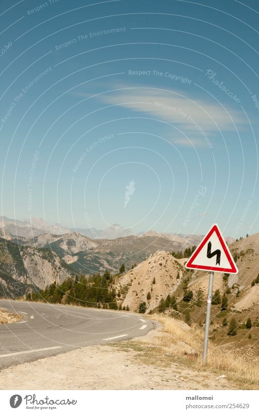 Warning sign in curve in front of alpine panorama Road sign Environment Nature Landscape Beautiful weather Trip Alps Mountain Curve Peak Transport Tilt