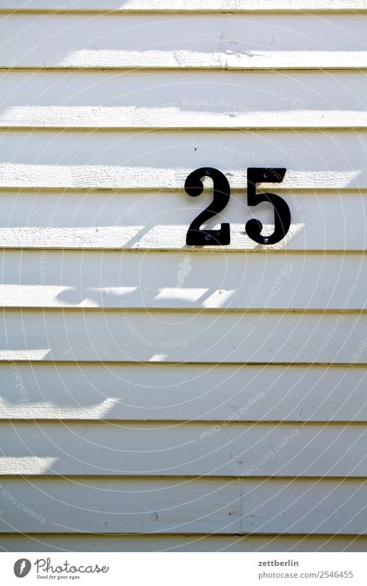 25 Digits and numbers House number Addressee Mail Ranking House (Residential Structure) Wooden house Facade Light Shadow 2525 Birthday Jubilee