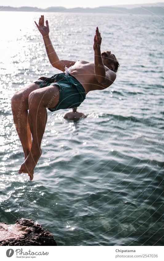Man Back-Flipping On A Beach Water Joy sea Ocean Sand backflip Summer Relaxation Freedom Vacation & Travel Action Acrobat Surf Happy Flying Sports Colour photo