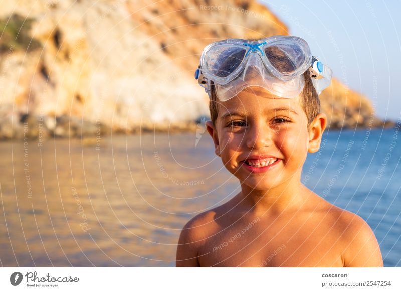 Kid with diving goggles on the shore of the ocean Lifestyle Joy Happy Relaxation Swimming pool Leisure and hobbies Vacation & Travel Summer Beach Ocean Sports