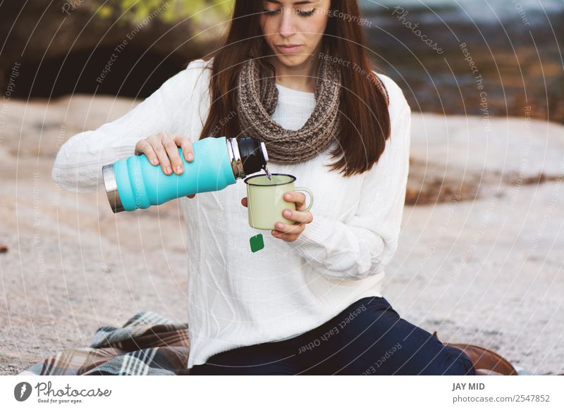 https://www.photocase.com/photos/2547852-young-woman-sitting-near-the-waterfall-food-photocase-stock-photo-large.jpeg