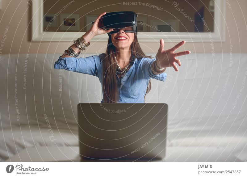 Woman experiencing virtual reality in home Lifestyle Happy Leisure and hobbies Playing Living or residing House (Residential Structure) Living room