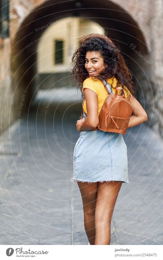 Rear view of smiling black tourist woman with curly hair Lifestyle Style Happy Beautiful Hair and hairstyles Face Tourism Human being Feminine Young woman