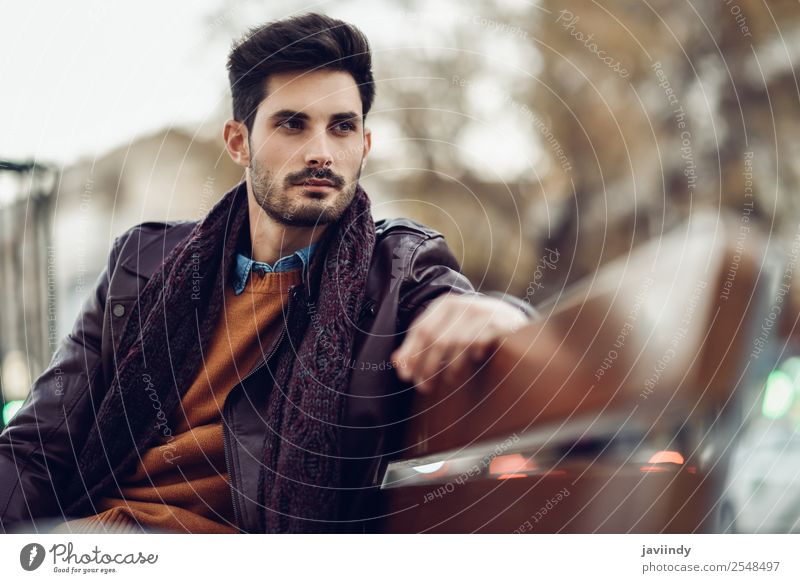 Thoughtful young man sitting on an urban bench. Lifestyle Style Beautiful Hair and hairstyles Human being Masculine Young man Youth (Young adults) Man Adults 1