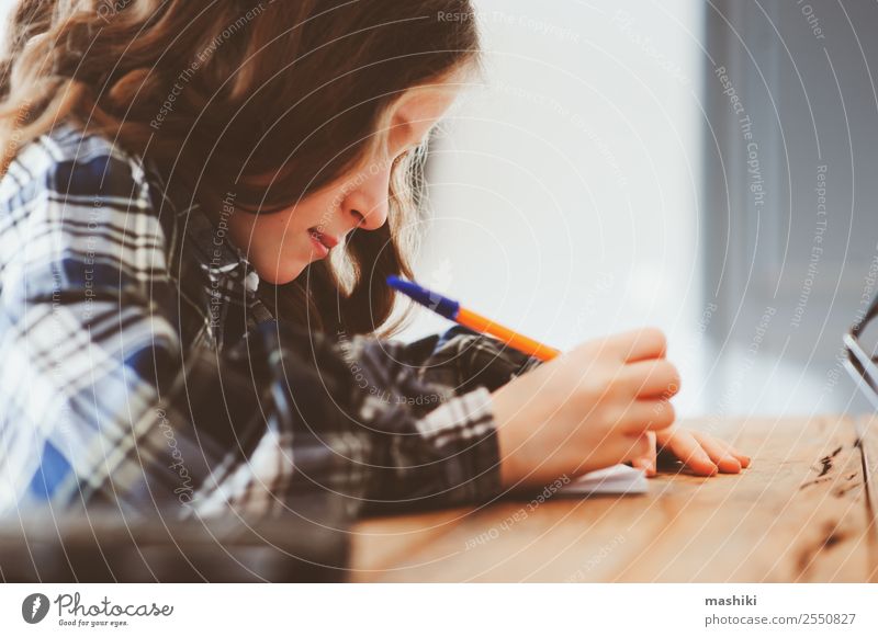 concentrated child girl doing homework Lifestyle Child School Schoolchild Work and employment Infancy Pen Think Dream Smart Stress Considerate Idea Concentrate