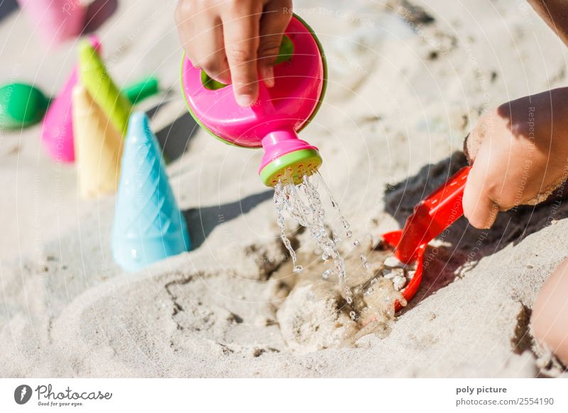 Child plays with watering can on the beach Leisure and hobbies Playing Vacation & Travel Tourism Trip Summer Summer vacation Sun Sunbathing Beach Toddler Girl