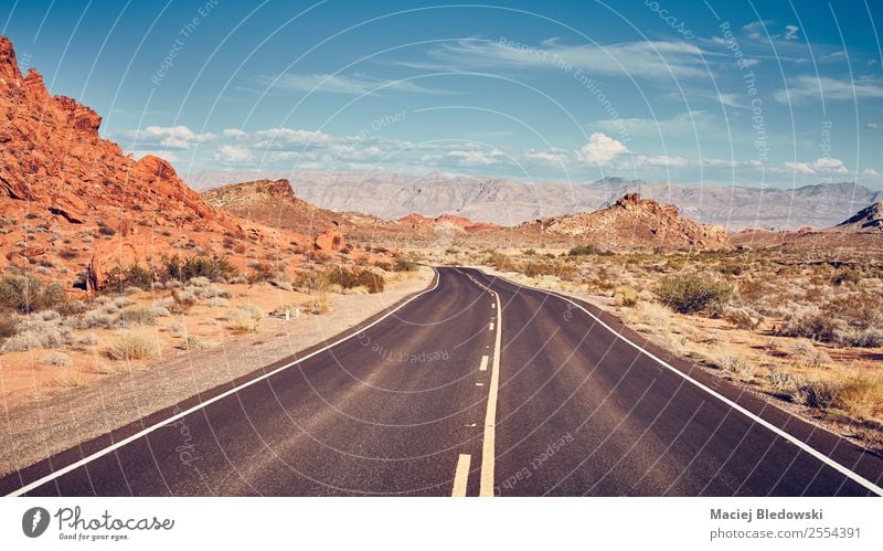 Retro stylized picture of a desert road. Vacation & Travel Tourism Trip Adventure Far-off places Freedom Expedition Camping Cycling tour Summer Summer vacation