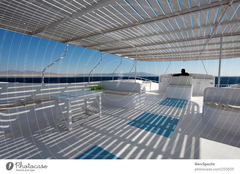 Half shade on the sun deck Vacation & Travel Tourism Trip Far-off places Man Adults 1 Human being 30 - 45 years Coast Ocean Navigation Boating trip Yacht