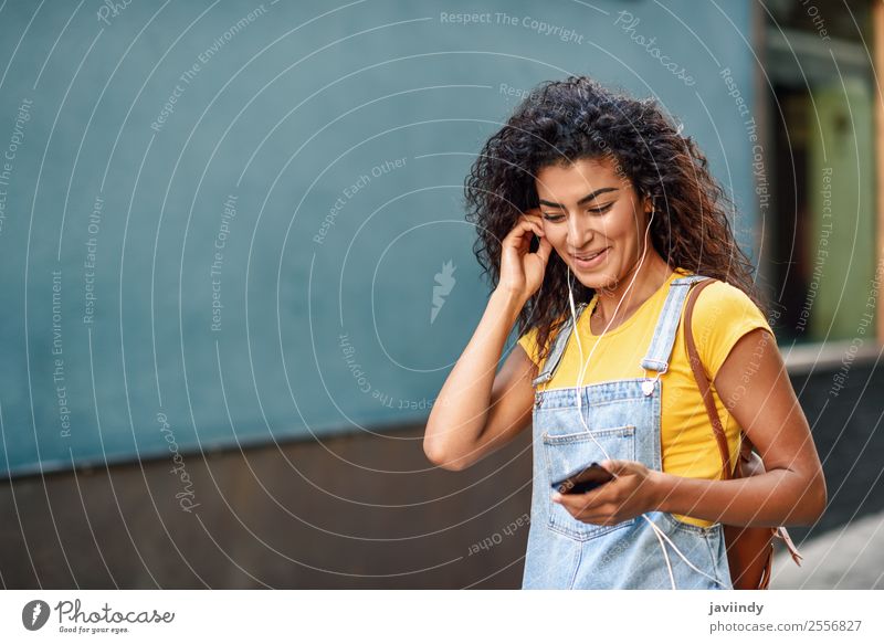 Happy Arab girl listening to music and dancing Lifestyle Style Beautiful Hair and hairstyles Music Telephone PDA Technology Human being Feminine Young woman