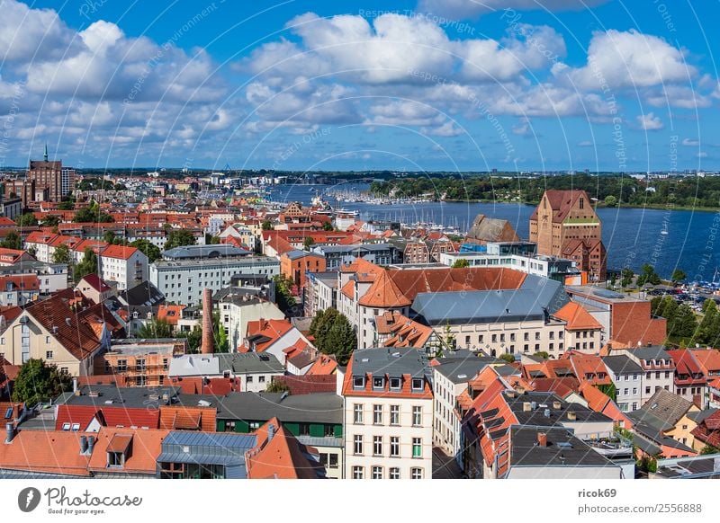 View of the Hanseatic city of Rostock Relaxation Vacation & Travel Tourism House (Residential Structure) Clouds Tree River Town Building Architecture Roof
