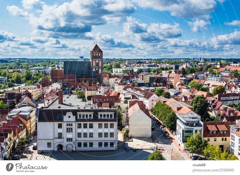 View of the Hanseatic city of Rostock Relaxation Vacation & Travel Tourism House (Residential Structure) Clouds Tree Town Building Architecture Roof Green Red