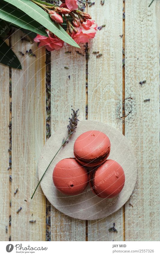 Pink macaroons, peach and lavender flavor Dessert Coffee Table Wood Delicious Colour Tradition Macaron background Peach food Teatime french Lavender sweet