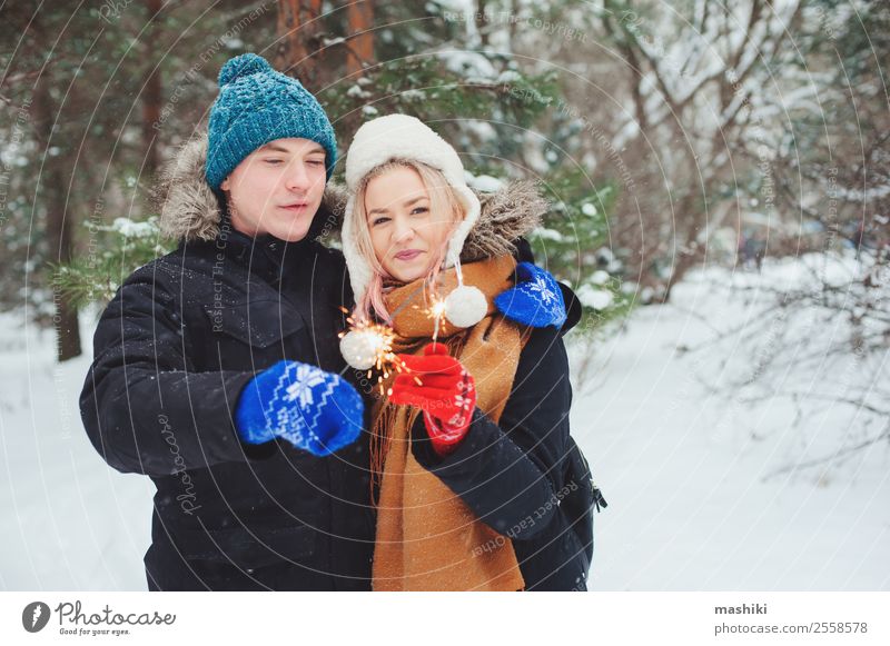happy young couple walking in winter snowy forest Joy Vacation & Travel Adventure Freedom Winter Snow Winter vacation Woman Adults Man Couple Nature Snowfall