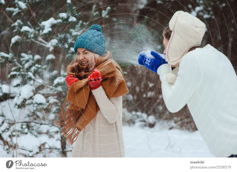 happy young couple playing on winter walk Joy Vacation & Travel Adventure Freedom Winter Snow Woman Adults Man Couple Nature Snowfall Park Forest To enjoy Love