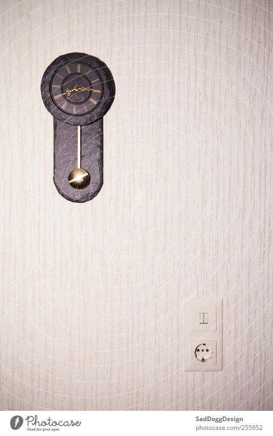 Crime scene about to start Decoration Clock Room Living room Light switch Socket Wallpaper Collector's item Brown Environment Time Electricity Power consumption