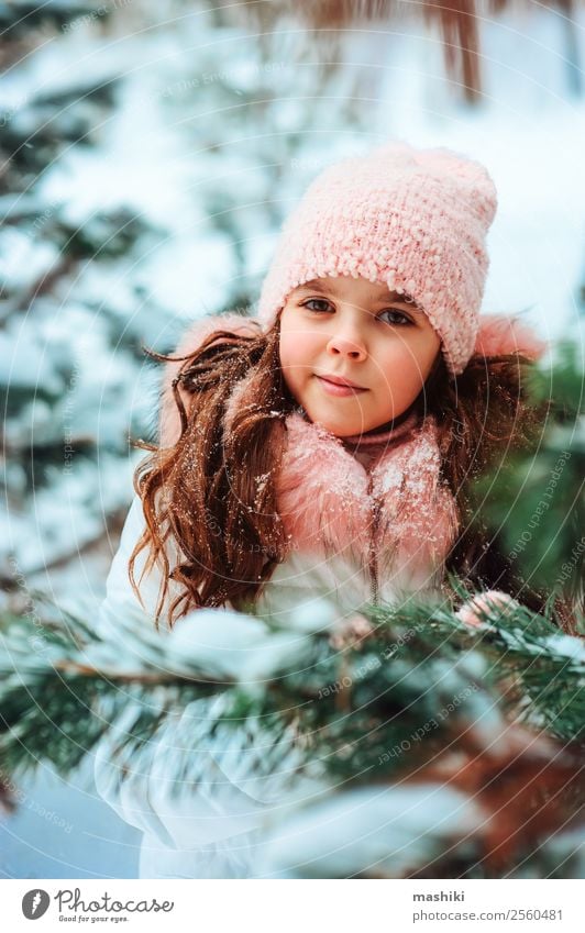 Winter portrait of cute smiling child girl in white coat Joy Vacation & Travel Adventure Freedom Snow Winter vacation Child Infancy Nature Snowfall Park Forest