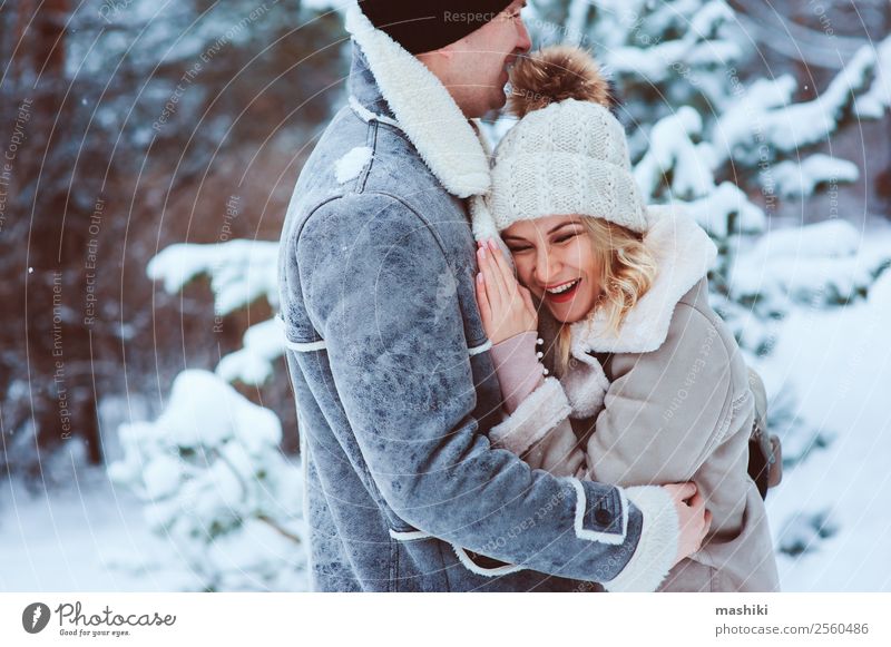 romantic winter portrait of couple embracing in snowy forest Joy Happy Knit Vacation & Travel Adventure Freedom Winter Snow Woman Adults Man Couple Nature