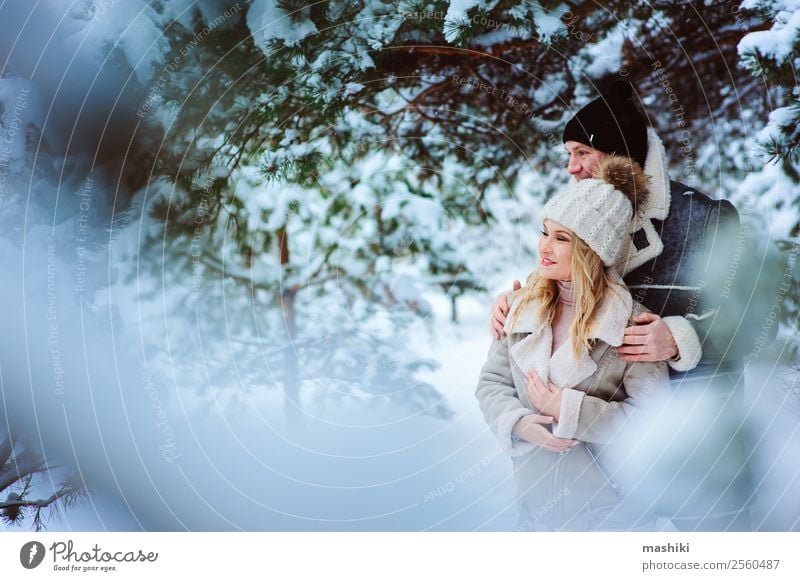Happy couple spending good day outdoor in snowy winter forest Lifestyle Joy Vacation & Travel Adventure Freedom Winter Snow Woman Adults Man Couple Nature