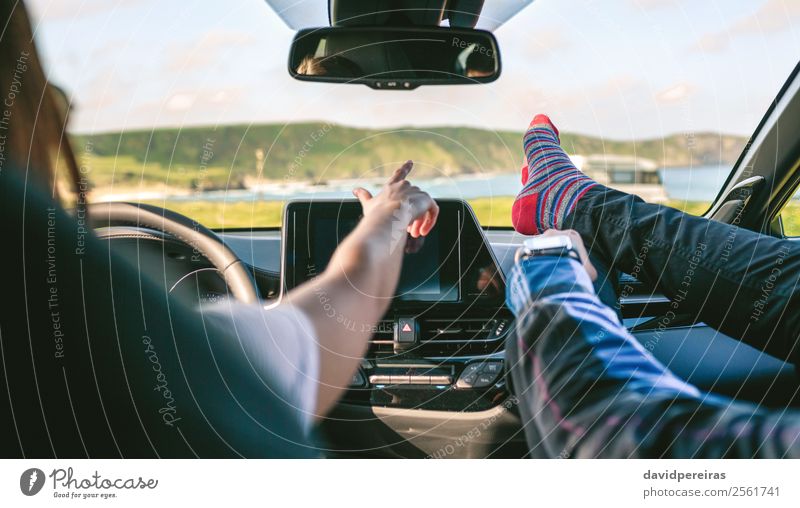 Young couple traveling by car feet up barefoot Lifestyle Joy Relaxation Leisure and hobbies Vacation & Travel Trip Adventure Human being Woman Adults Man